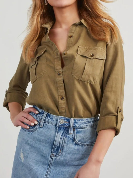 Collared denim top with button-up front and roll-tab sleeves for women