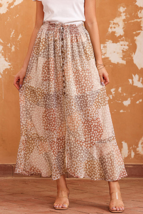 Woman wearing a floral boho maxi skirt with button front and side slit
