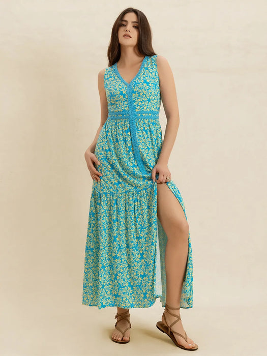 Woman wearing a breezy sleeveless viscose slit maxi dress, ideal for summer comfort