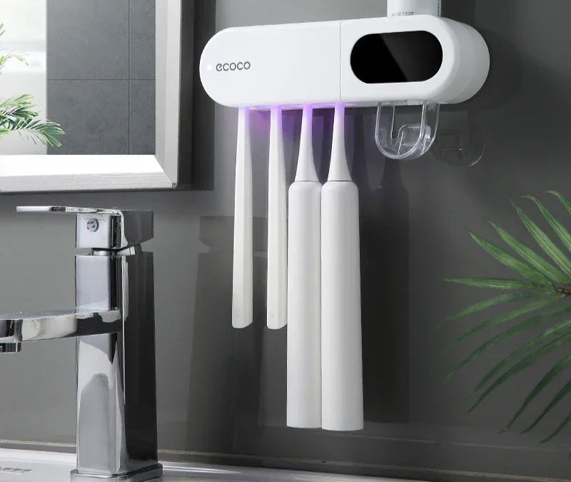Modern wall-mounted toothbrush holder with 4 magnetic cups, built-in toothpaste dispenser, and LED display showing time and temperature