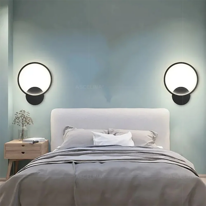 Modern LED wall light with die-cast aluminum finish, mounted in a bedroom with adjustable brightness and color settings