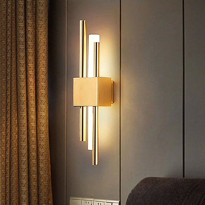 Black and gold contemporary LED wall lamp with dual up-and-down lighting for modern interiors.