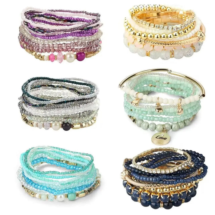 Bohemian handmade bracelet set featuring stackable beaded bangles with crystals, pearls, and colorful designs