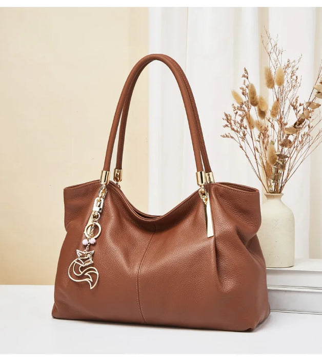 FOXER genuine leather women’s shoulder bag with zipper closure, interior compartments, beading and sequins, soft casual tote.