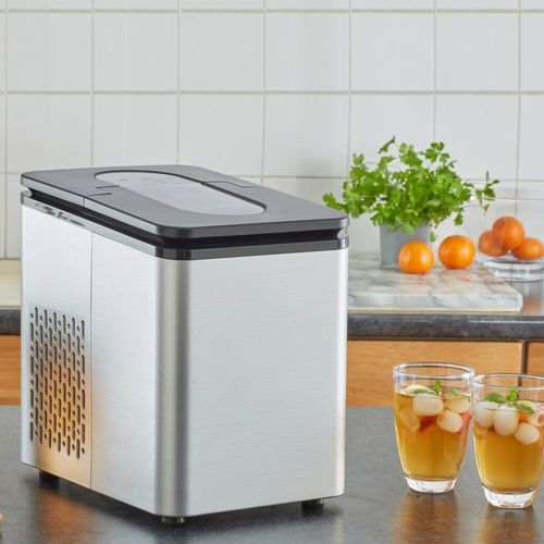 Compact ice cube maker with bullet ice, chrome finish, transparent lid, and included ice scoop