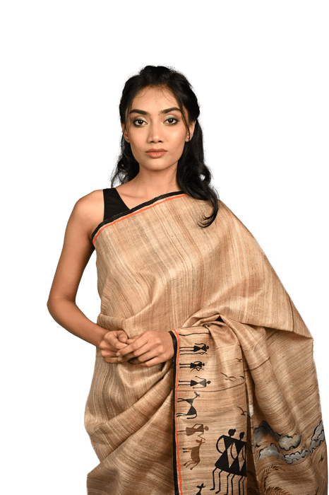 Handwoven Tussar Silk Saree with Warli tribal art showcasing geometric motifs and traditional Indian designs
