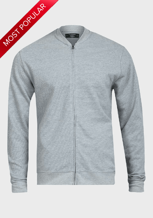 Man wearing a waffle-knit bomber jacket in Pique Grey with a tailored fit