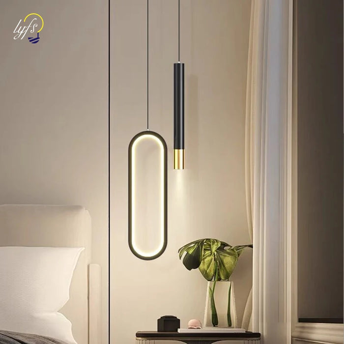 Elegant black and gold LED pendant light for modern living rooms, kitchens, and bedrooms.
