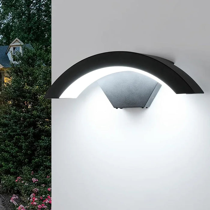 LED wall lamp mounted on outdoor garden wall providing warm waterproof lighting