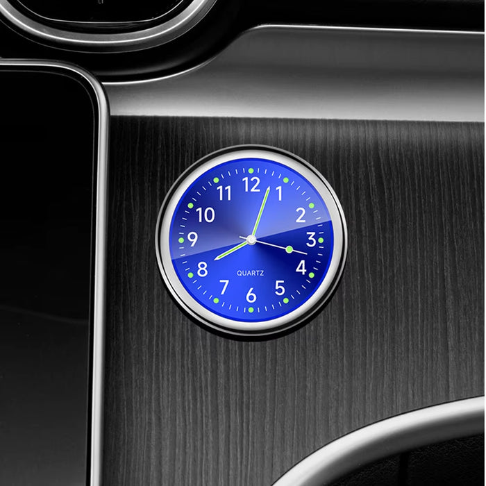 Stylish mini car air conditioner clock with adhesive backing in silver, black, blue, green, and red, featuring a quartz movement and luminous pointer.