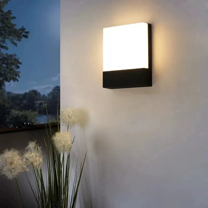 Modern LED wall lamp with IP65 waterproof protection and polished chrome finish for outdoor spaces