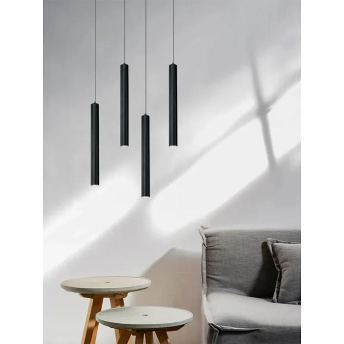 Nordic cylinder LED pendant light with black aluminum shade in modern dining room