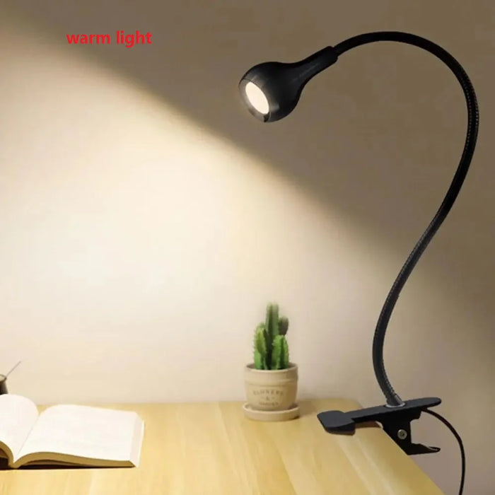 USB LED book light with flexible clip holder for adjustable lighting, ideal for reading and study.