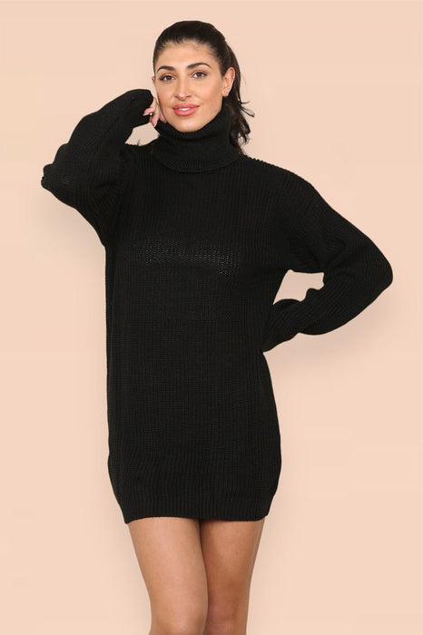 Woman wearing oversized fluorescent ribbed roll neck jumper dress with dropped shoulders
