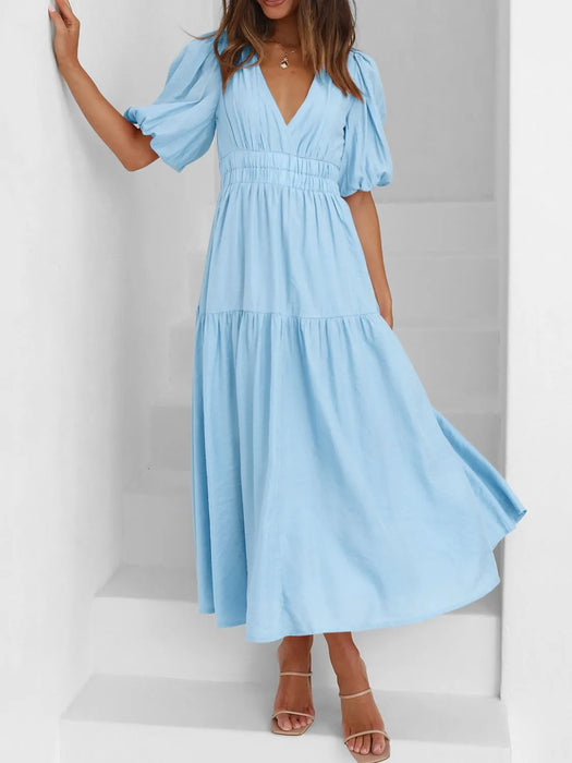 Elegant puff sleeve dress with ruched waist, perfect for formal events and casual wear.