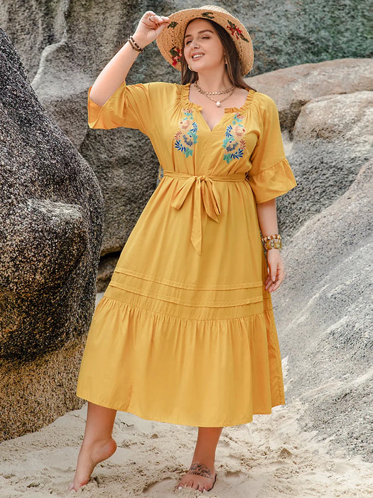 Yellow plus size midi dress with notched neckline and ruffle sleeves