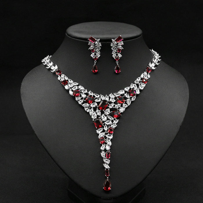 Gold-plated red ruby necklace set with cubic zirconia stones for women, elegant jewelry on white background