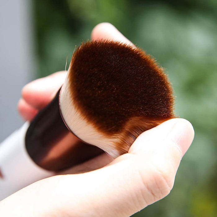 Flat top vegan foundation brush with synthetic bristles and elegant wooden handle