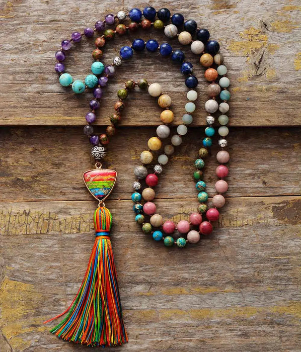 Hand-strung chakra healing necklace with triangle charm and 7 semi-precious stones for spiritual balance