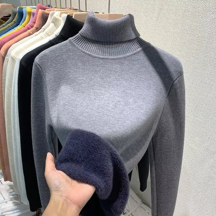 Women’s turtleneck plush fleece sweater, warm winter pullover, cosy fleece lining, stylish cold-weather jumper.