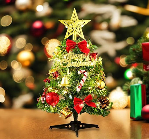Mini tabletop Christmas tree with warm light and festive ornaments