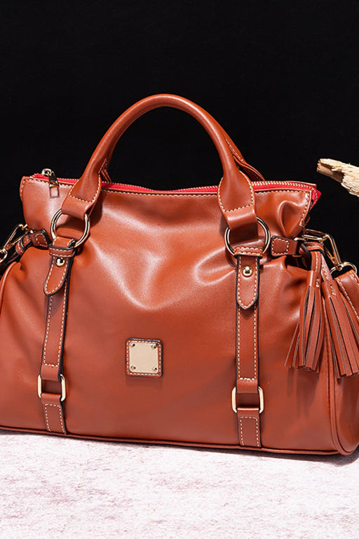  Solid-color PU leather handbag with zipper closure and tassel pendant