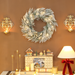 Snow-dusted LED Christmas wreath with warm white lights for indoor décor