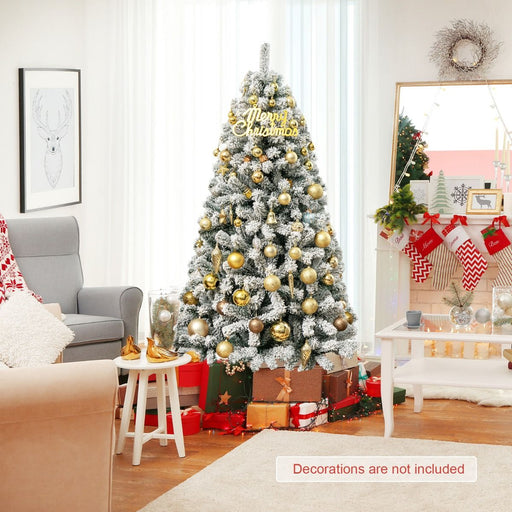 Snow-flocked artificial Christmas tree with full PVC branches and a metal stand



