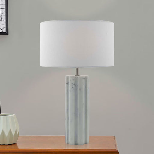 Erebus table lamp with marble effect resin base, polished chrome detailing, and white linen shade