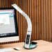  desk lamp with wireless charging pad, adjustable brightness, and color-changing base on a modern desk