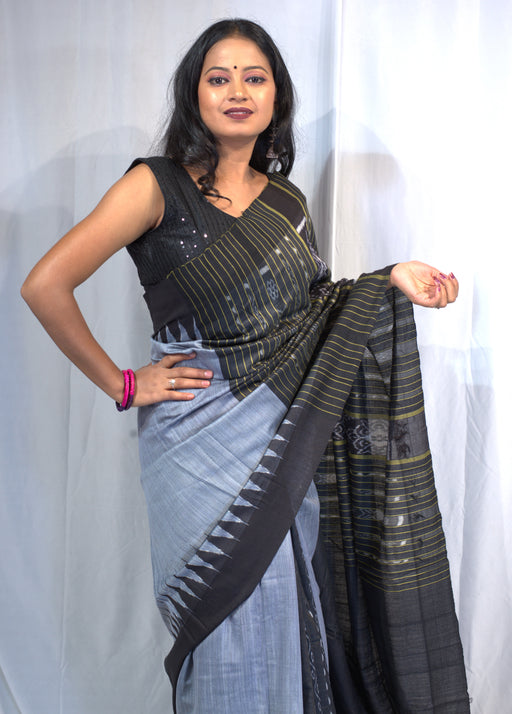 Handwoven Tussar silk saree with golden sheen and intricate Madhubani and Pattachitra-inspired motifs, including matching blouse piece