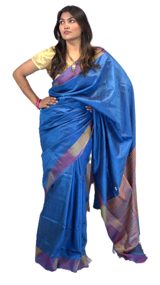 Handwoven Tussar silk saree with golden sheen, featuring Madhubani and Pattachitra-inspired motifs, includes matching blouse piece