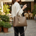 Elegant commuter tote bag in solid color with detachable strap, displayed as both shoulder bag and crossbody option, spacious and stylish design for men and women.