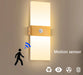 Modern LED wall light with PIR motion sensor, up & down design, black aluminum body, and acrylic shade for bedroom and corridor lighting