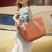 Soft genuine leather casual tote bag for women with multiple interior pockets and zipper closure