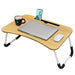 Foldable laptop bed desk with anti-slip legs used as workstation and tray table