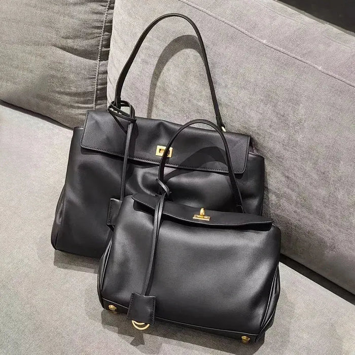 Women’s casual leather satchel with hasp closure and organized interior
