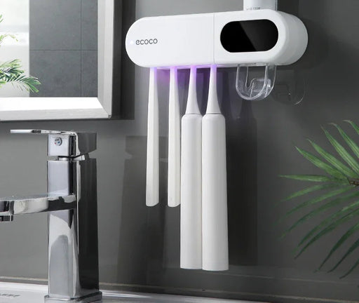 Modern wall-mounted toothbrush holder with 4 magnetic cups, built-in toothpaste dispenser, and LED display showing time and temperature
