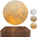 Magnetic levitating 3D moon lamp hovering above base, glowing in three soft colors