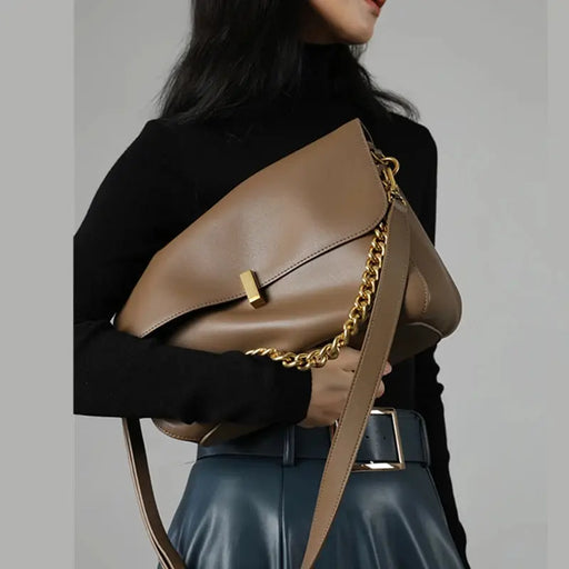 Women’s soft cow leather shoulder bag with chain accent and flap design