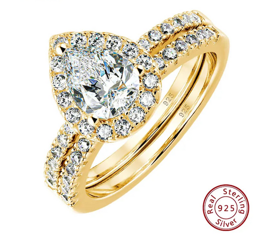 Pear cut yellow gold tone sterling silver bridal ring set with halo zircon.