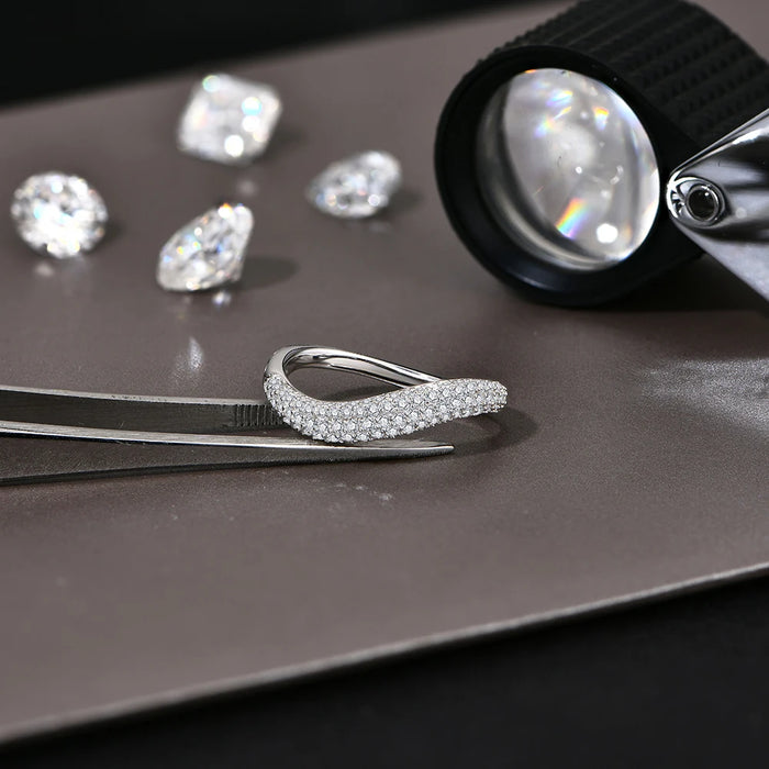 Sterling silver wavy band with D-color VVS1 moissanite stone for women