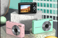 Compact digital camera with 2.5-inch HD screen, 44MP photo resolution, 1080P video recording, and face detection, placed on a desk with travel accessories

