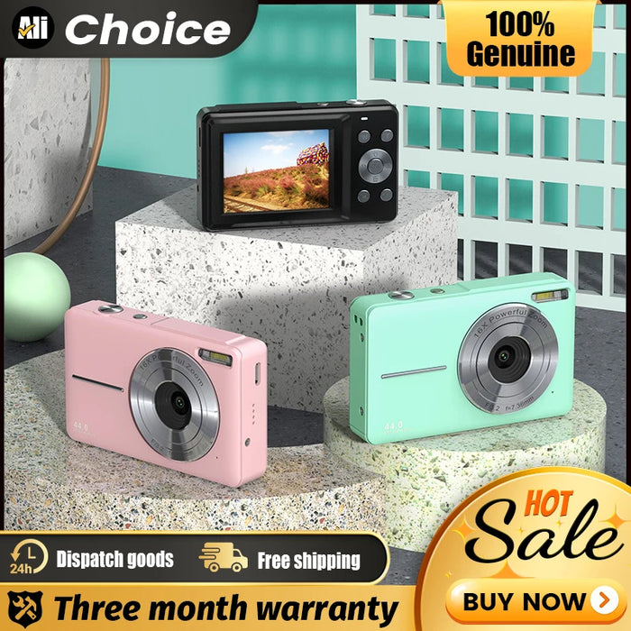 Compact digital camera with 2.5-inch HD screen, 44MP photo resolution, 1080P video recording, and face detection, placed on a desk with travel accessories

