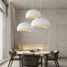 Nordic Wabi-Sabi 3-Light LED Pendant Lamp hanging over modern UK dining table with minimalist décor