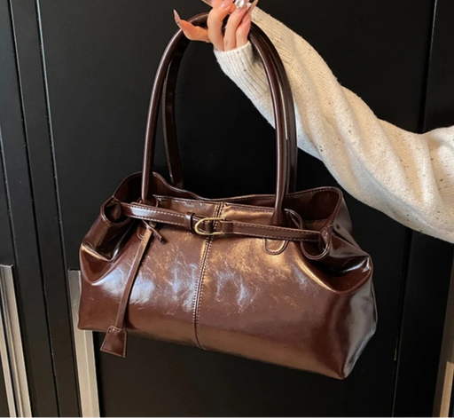 Women’s vintage PU casual tote bag with tassel detail, zipper closure, and spacious compartments