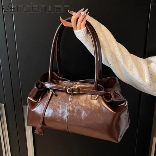 Women’s vintage PU casual tote bag with tassel detail, zipper closure, and spacious compartments