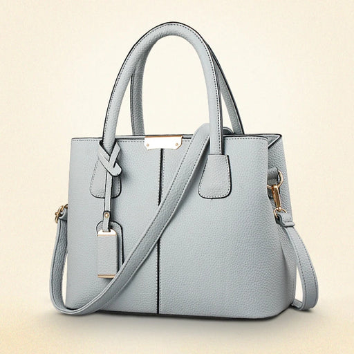  Fashion Satchel PU Leather Bag with solid design, featuring spacious interior with cell phone and zipper pockets.