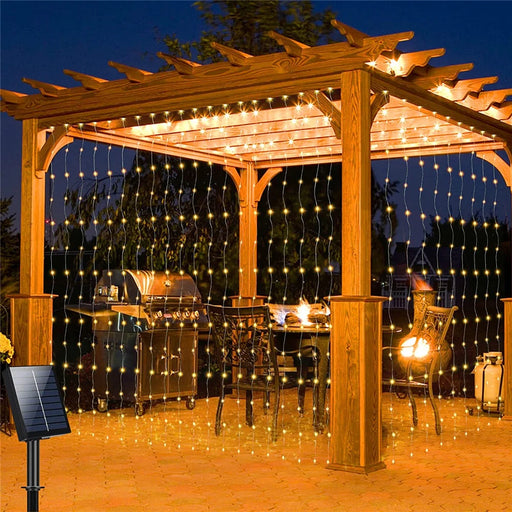 Solar-powered LED curtain lights in multicolor with IP65 waterproof design and remote control for outdoor holiday decoration