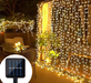 Solar-powered LED curtain lights in multicolor with IP65 waterproof design and remote control for outdoor holiday decoration